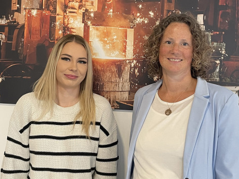 Trainer Caroline Bauer (right) congratulates Cheyenne on her successful final exam